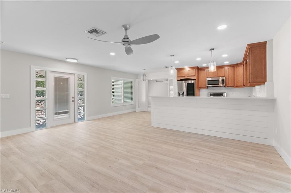 FRONT DOOR, DINING AND  living room with recessed lighting, ceiling fan, and light wood-type flooring