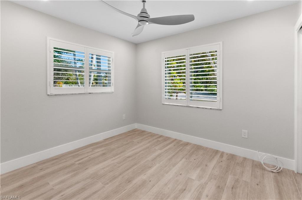room featuring light wood-type flooring, ceiling fan, and recessed lighting