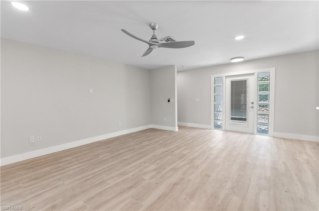 Unfurnished room featuring a ceiling fan, light wood finished floors, and recessed lighting