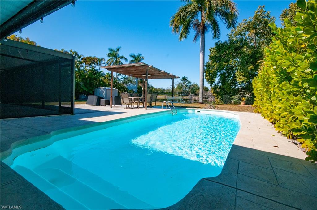 View of swimming pool with patio surround