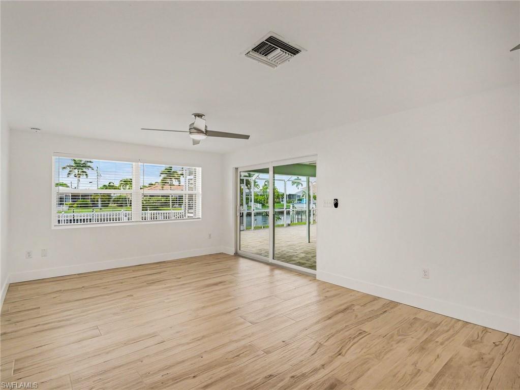 Family room with slider doors out to the large screened in lanai (extra living space)
