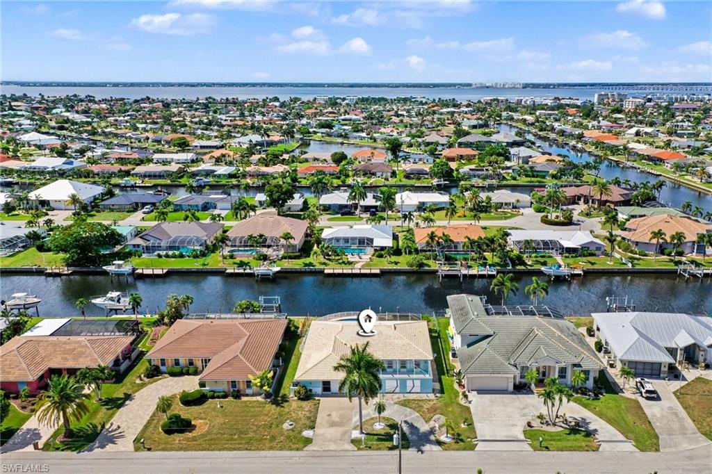 Welcome to 548 Belvedere Ct - your dream waterfront setting only 6-8 minutes to open water (looking north at canal system and view of Peace River meeting Charlotte Harbor)