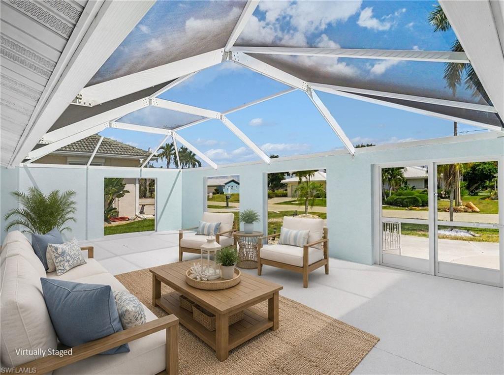 Spacious front courtyard with lots of Florida charm - extend your living space even more! (virtually staged)