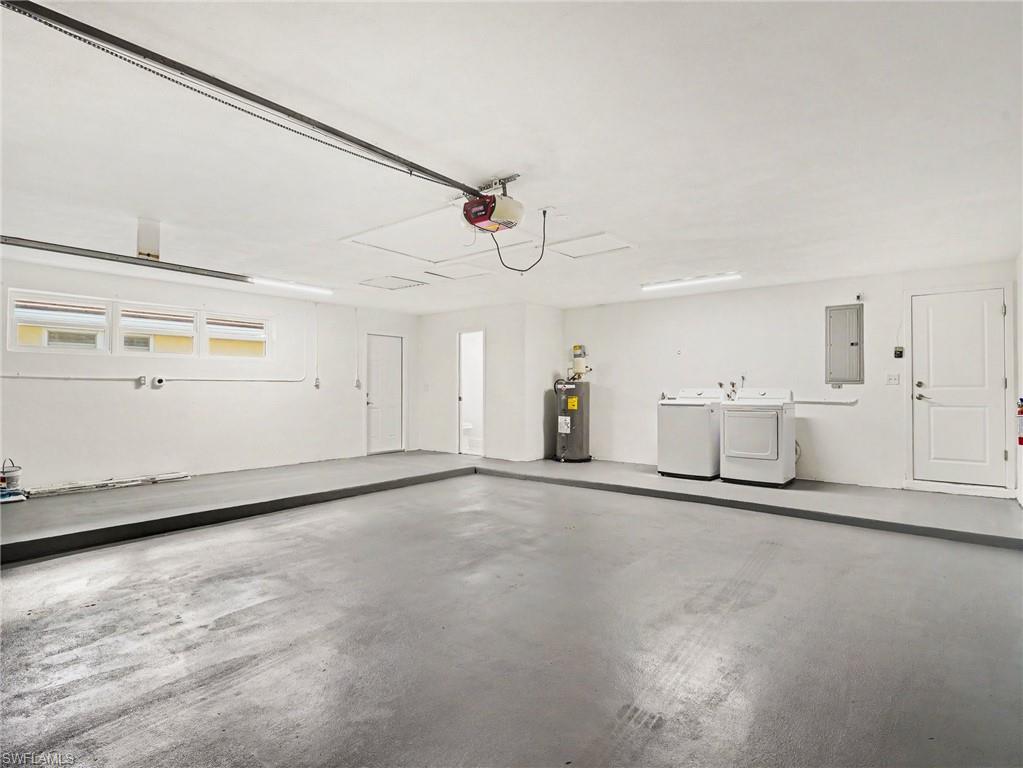 Oversized garage with laundry, 1/2 bath and plenty of room for a workshop