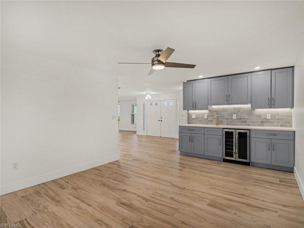 Large, open family room with wet bar to the left as you come in through the front door