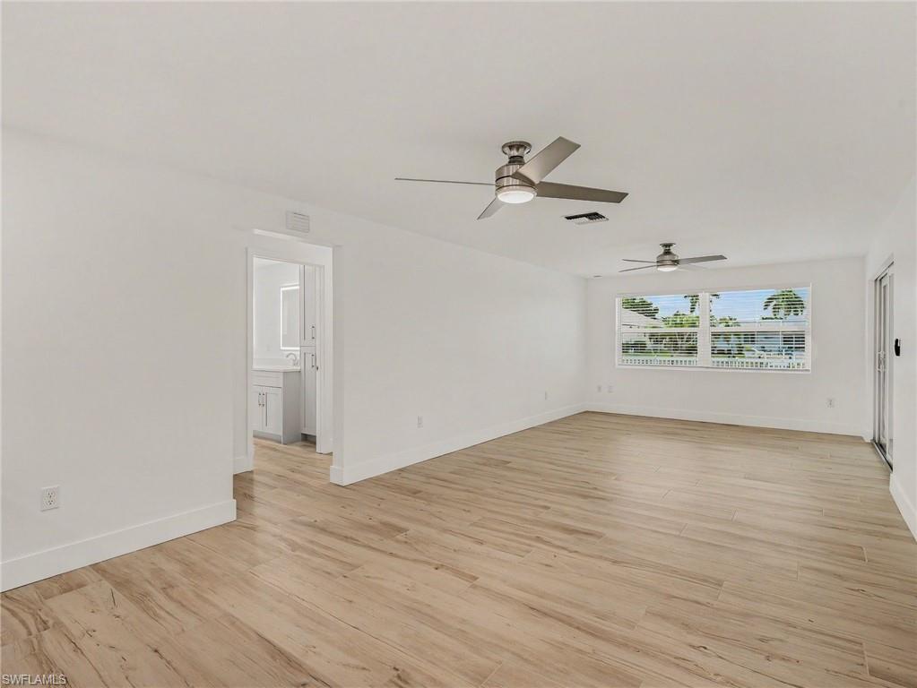 Family room looking toward back yard/pool from wet bar area