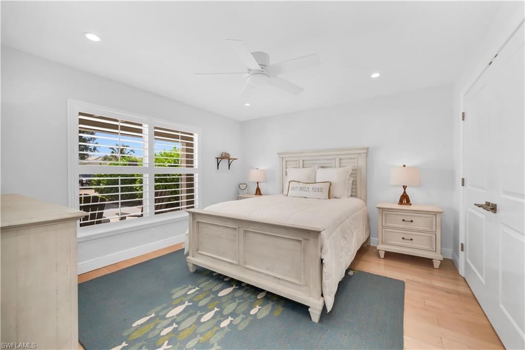 Bedroom featuring light wood finished floors, recessed lighting, and a ceiling fan