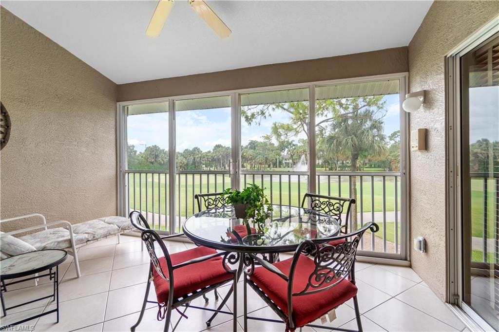 Sunroom with plenty of natural light, ceiling fan, and lofted ceiling
