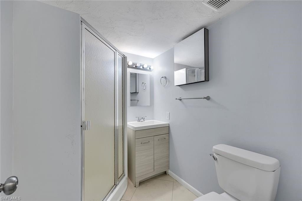 Guest bathroom features a walk-in shower.