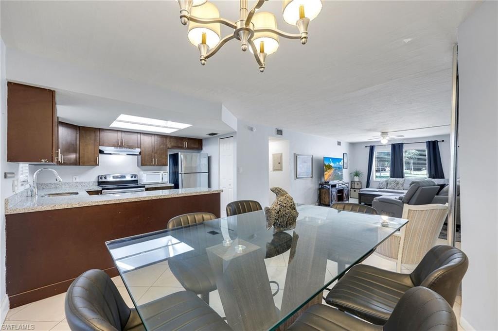 Dining room, kitchen and living room are open to one another.