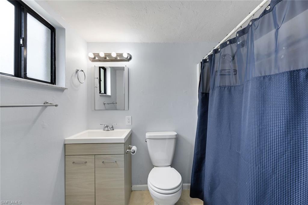 Ensuite primary bathroom with a shower and tub.