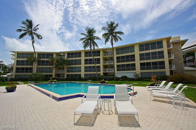 Community pool with a patio area