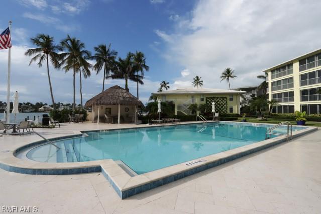 Community pool featuring a patio area