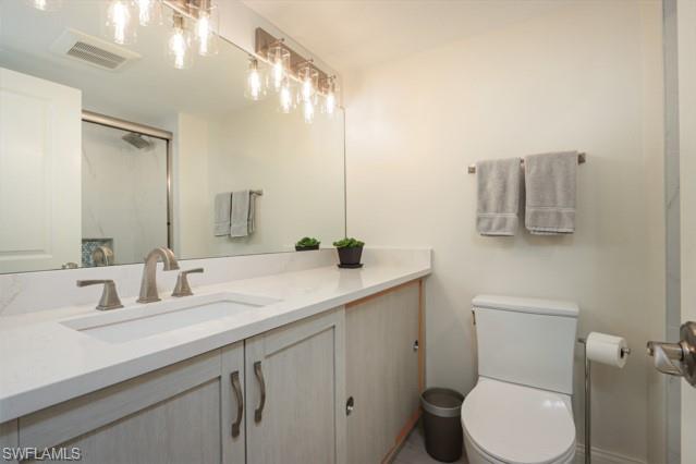 Bathroom with vanity and an enclosed shower