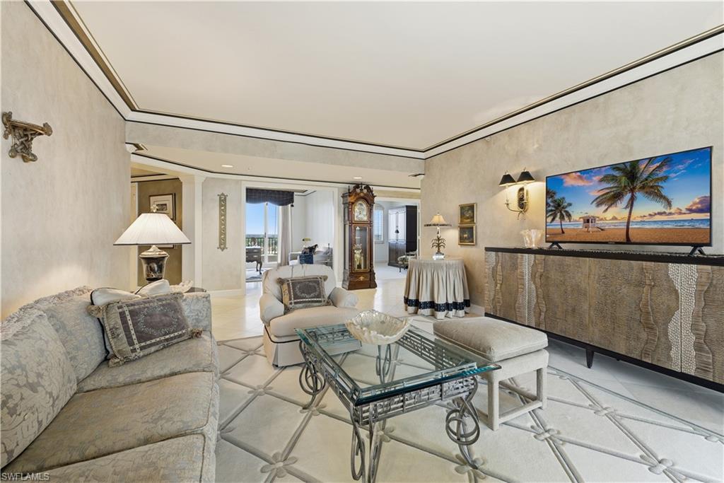 Tiled living room featuring ornate columns