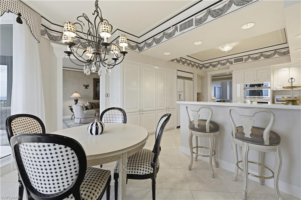 Dining space featuring a chandelier and light tile patterned floors