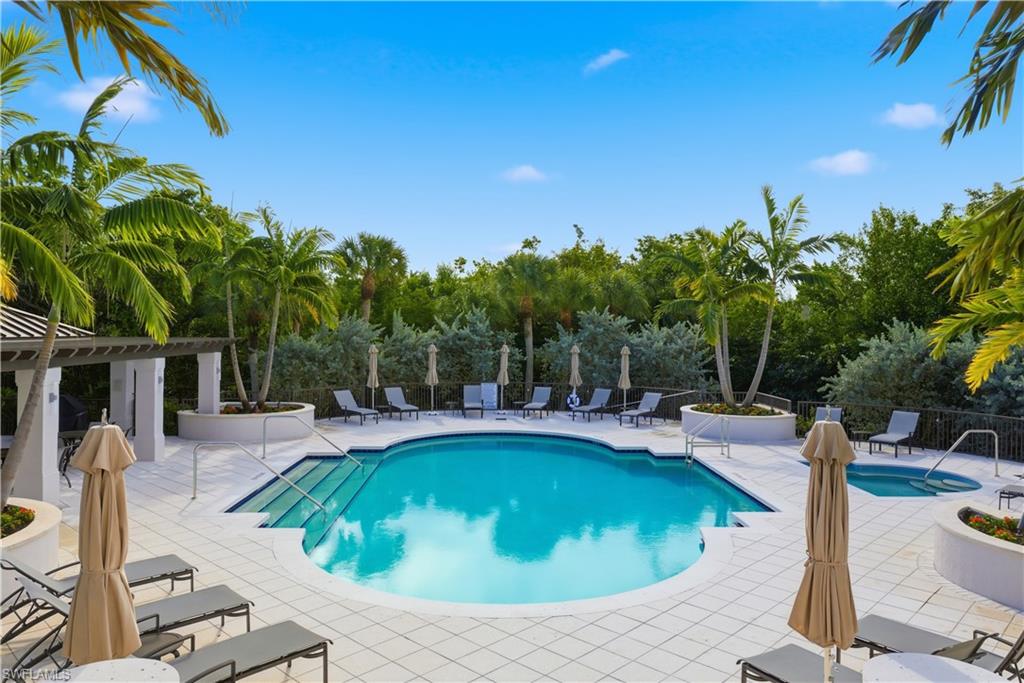 Community pool featuring a patio