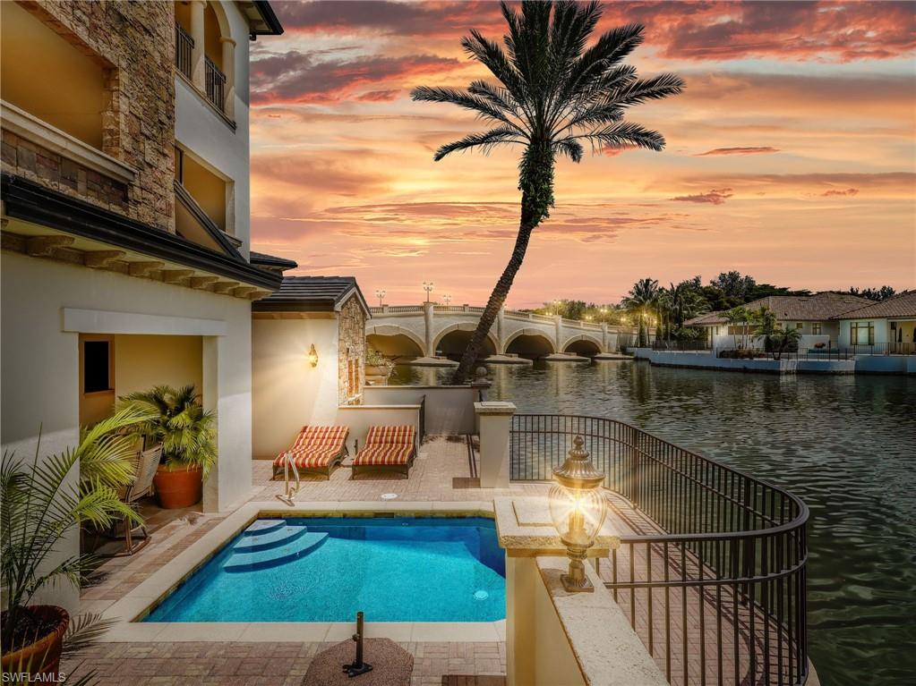 Terrace w/ sparkling pool/spa overlooking the lake