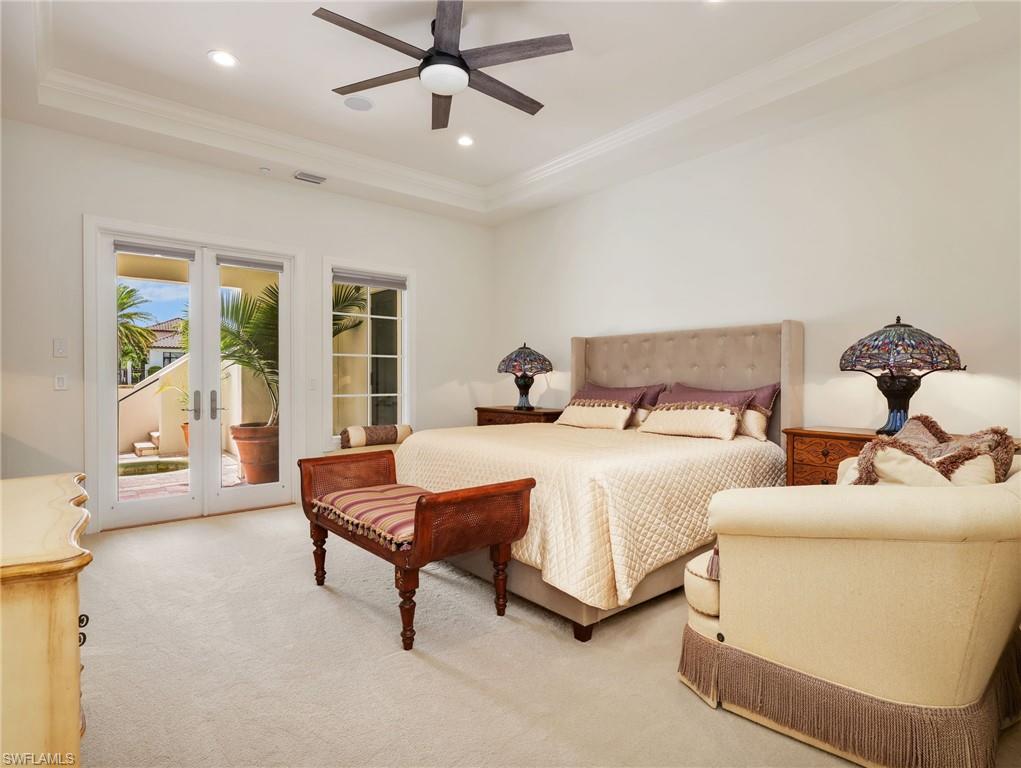 Owner's Suite Bedroom with wet bar and doors heading out to the private pool/spa - Ground Level