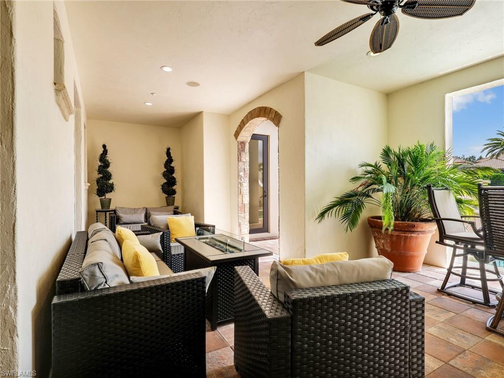 Ground Level Outside Sitting area with a fire pit featuring the pool bathroom