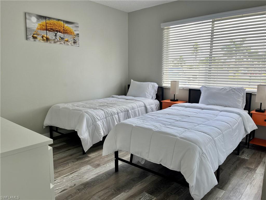 Twin Beds with large window and closet