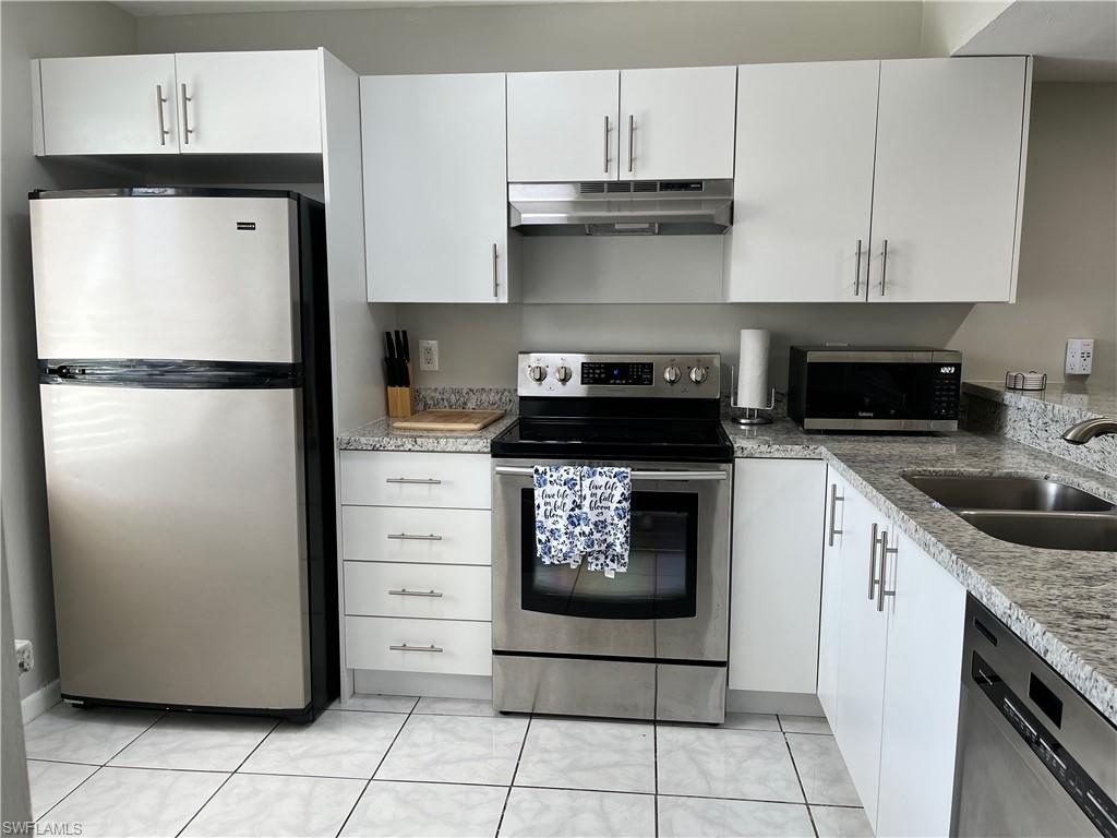 Large kitchen with stainless steel appliances