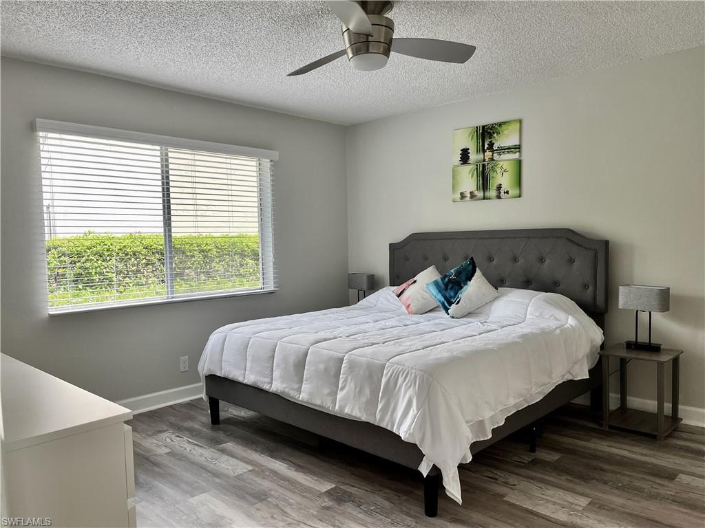 Vinyl Plank Flooring with TV and King size bed