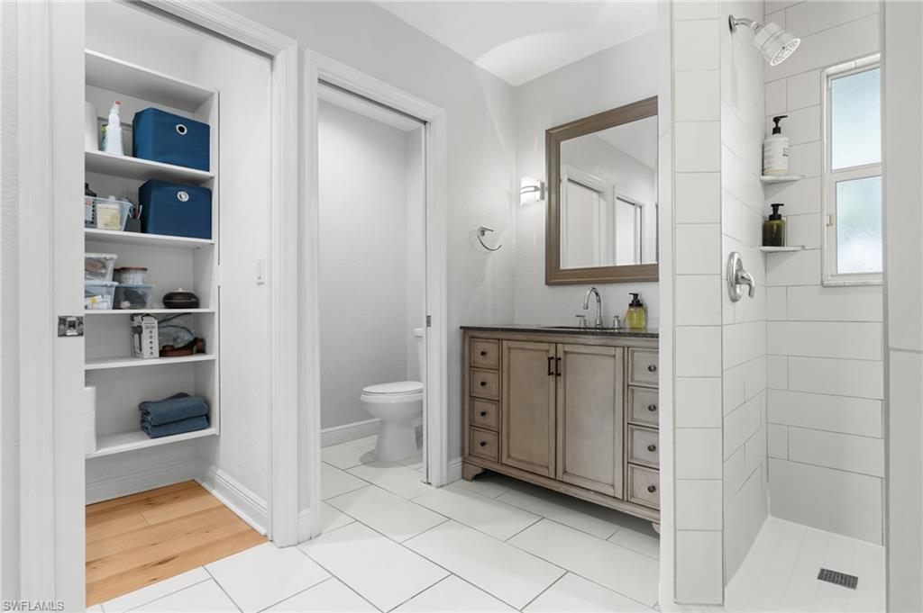 A private toilet area, and built-in shelving