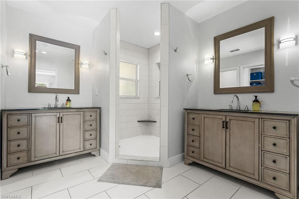 Master bathroom with dual vanity areas