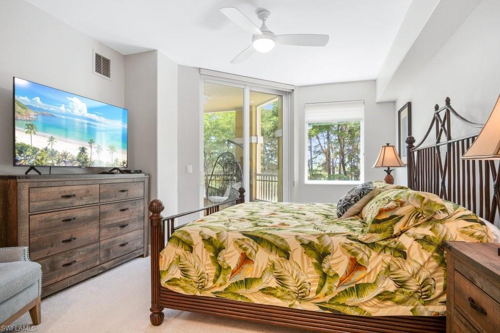 GUEST BEDROOM W/KIN SIZE BED AND ACCESS TO SCREENED IN LANAI