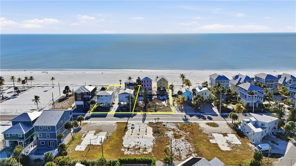 Beachfront parcel featuring direct access to the sand, established surrounding properties, and ample space for development