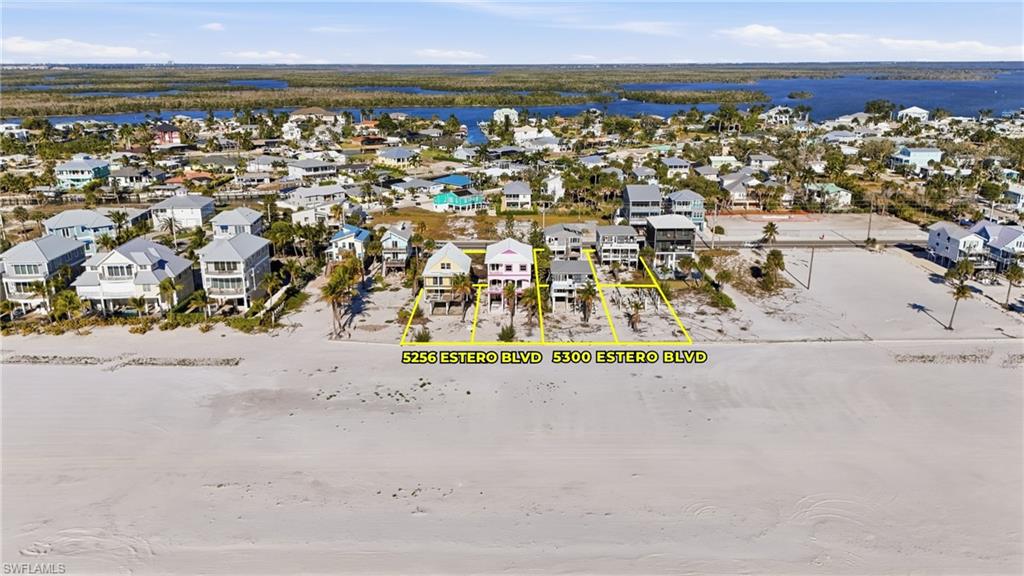 Coastal property featuring direct sandy beach access