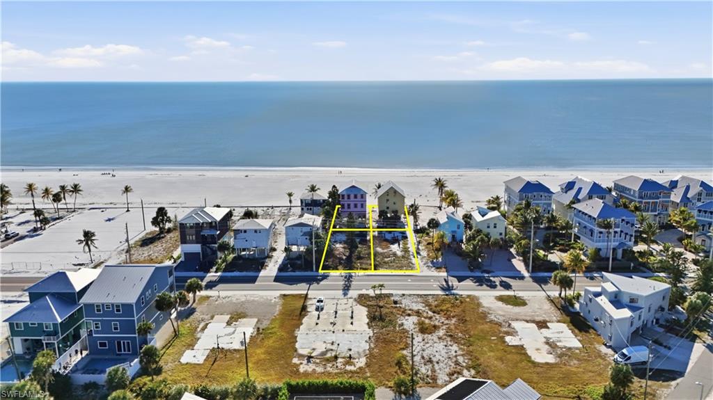 Aerial view of residential area with expansive beach