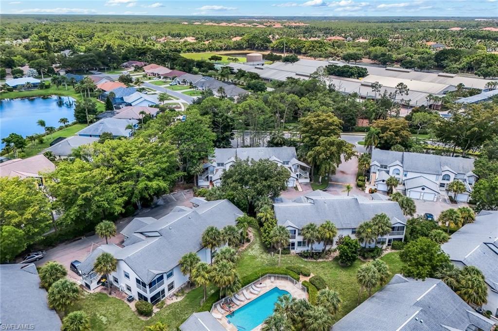 End unit surrounded by trees for privacy and desirable location in central Naples.