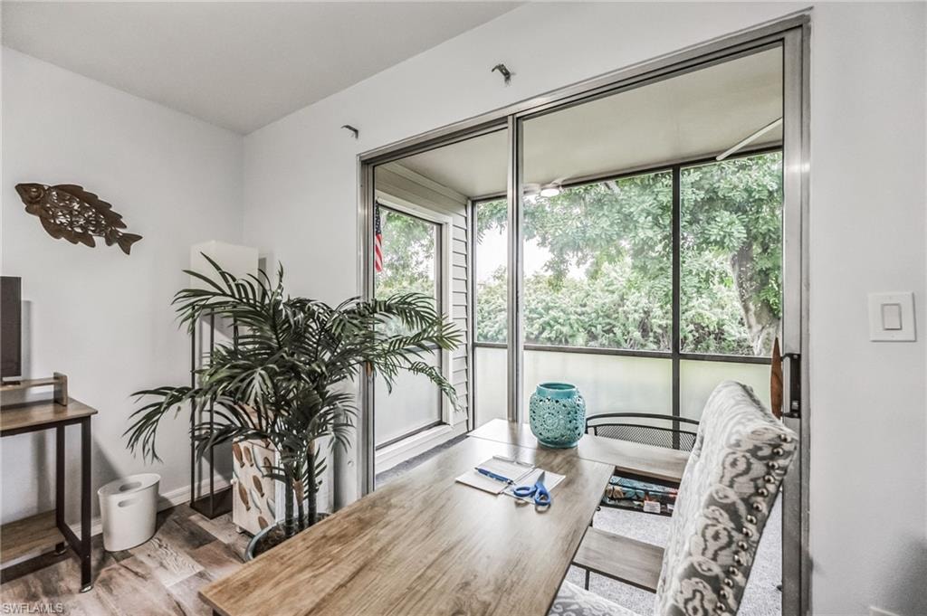 Bright interior space with wood-finish flooring and white walls