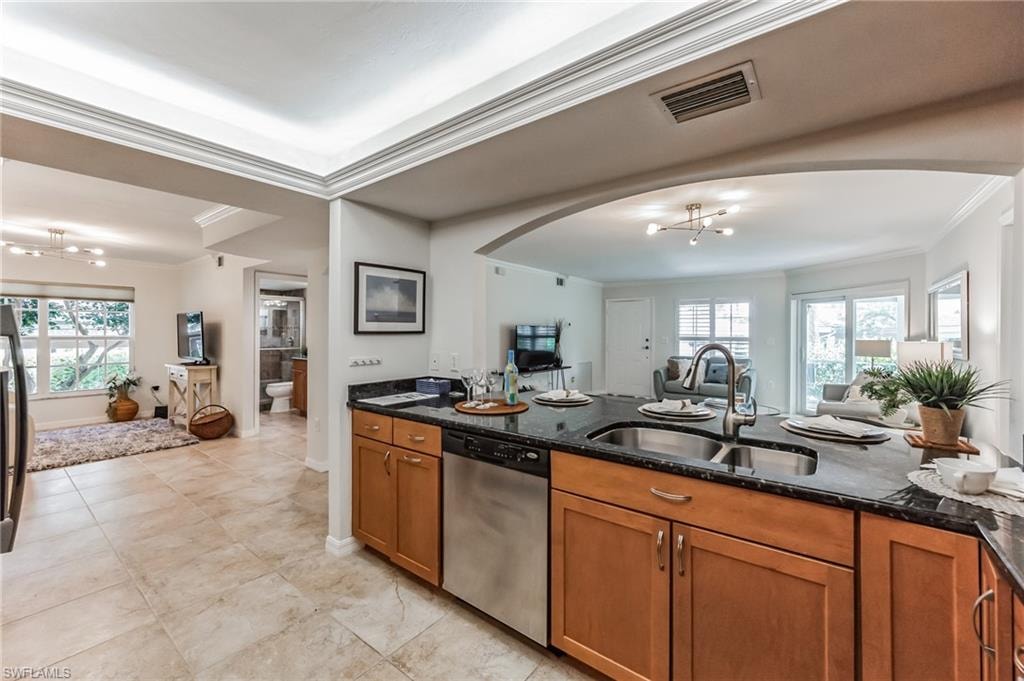 Kitchen island with a double basin stainless steel sink and gooseneck faucet