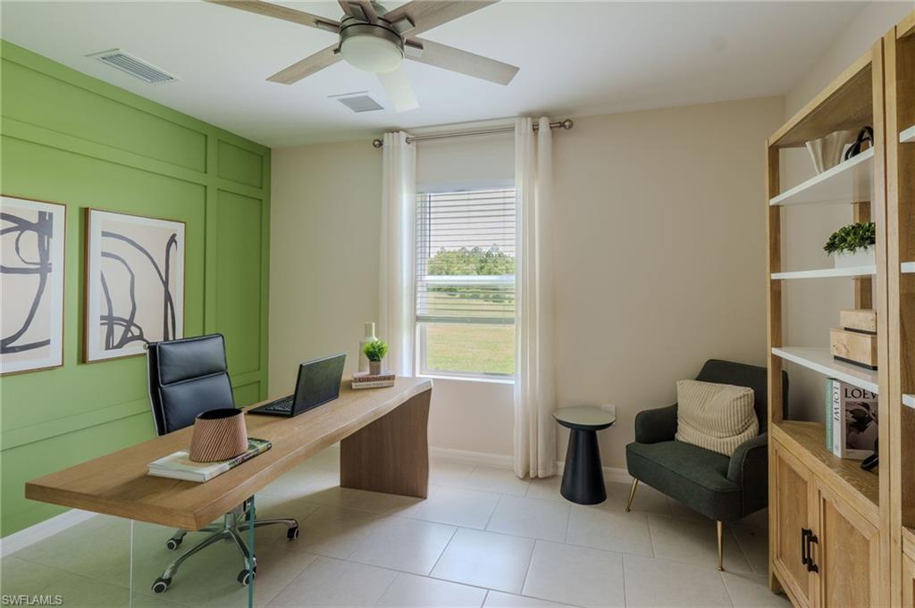 Bright room featuring a prominent accent wall with panel detailing