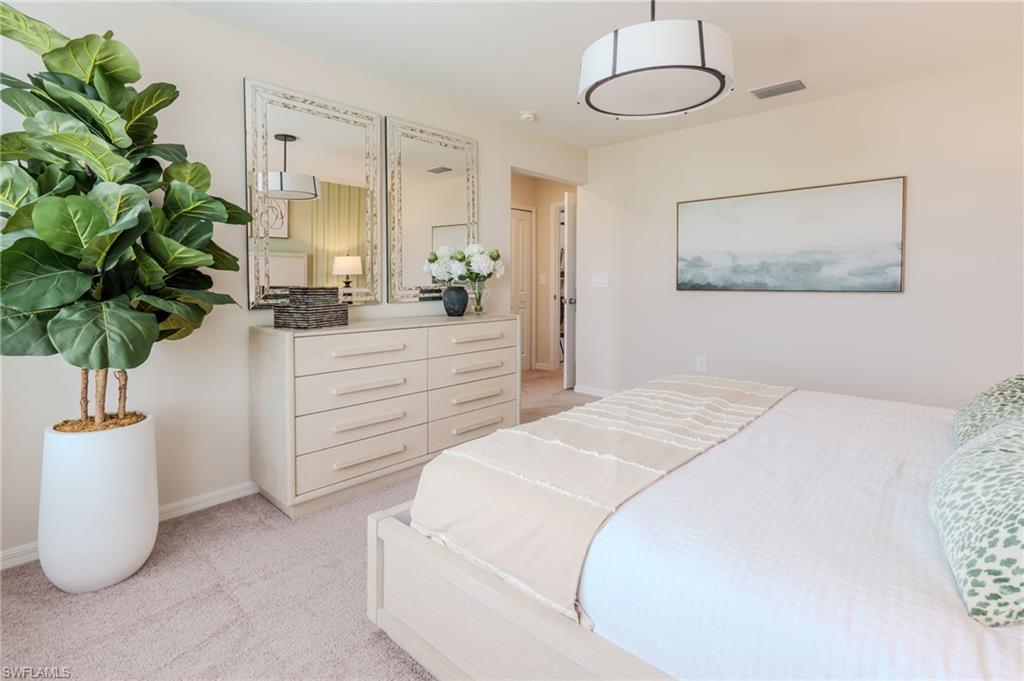 Plush carpet flooring complements light-toned walls