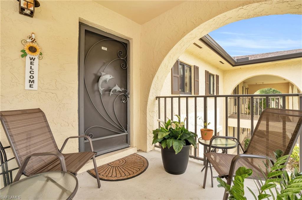 Entrance to property featuring a balcony