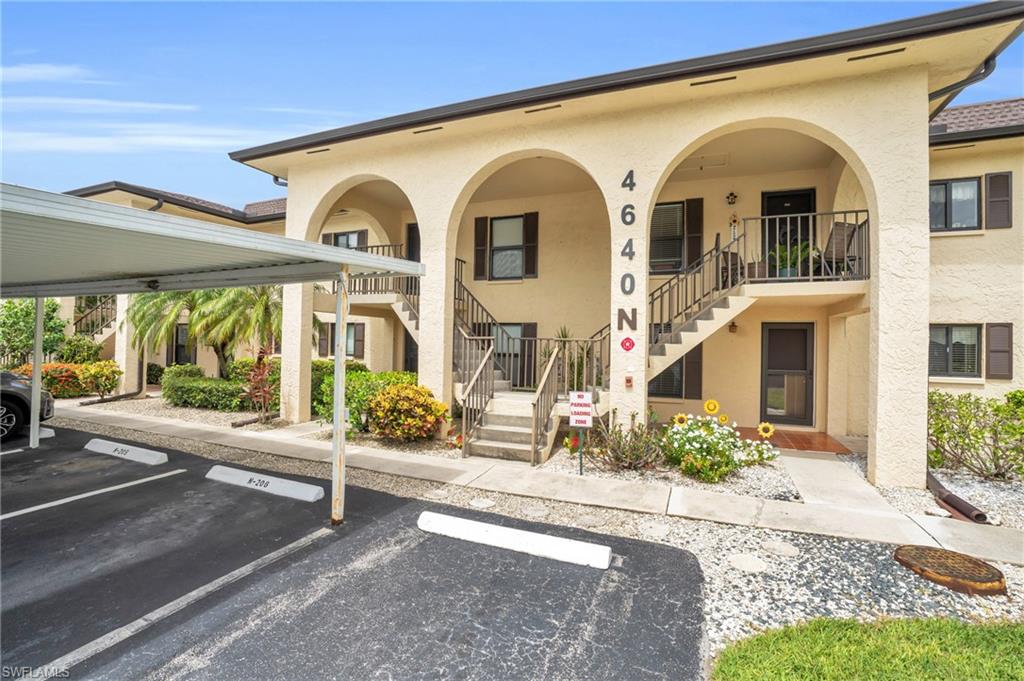 View of property with a carport