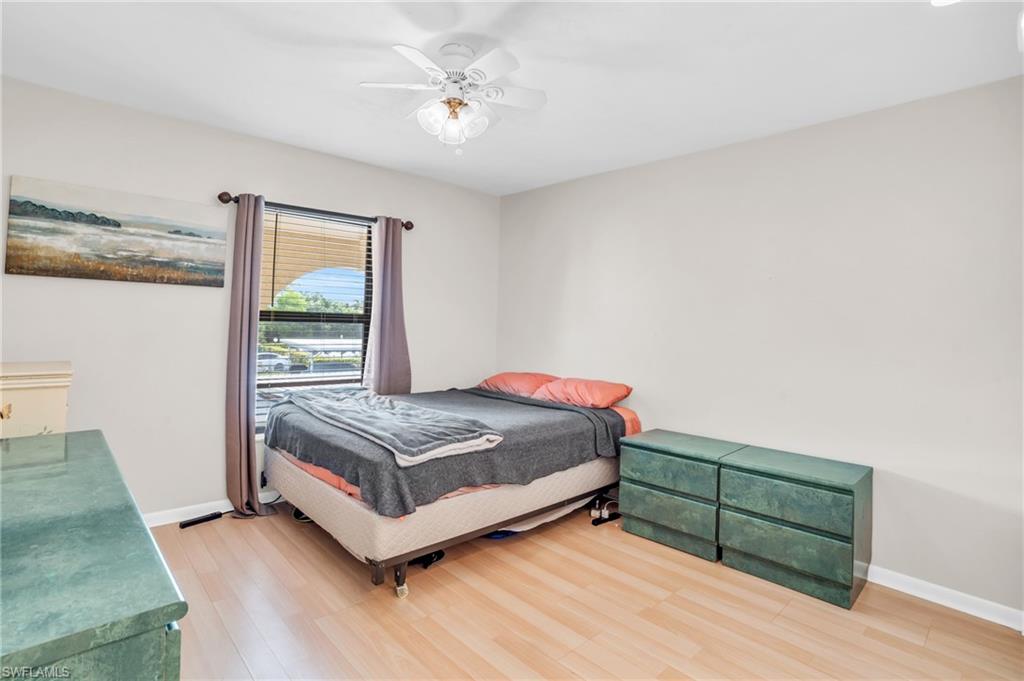 Bedroom featuring hardwood / wood-style flooring and ceiling fan
