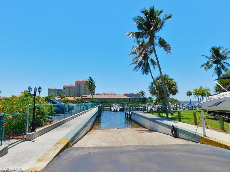 View of community featuring a boat ramp and a water view