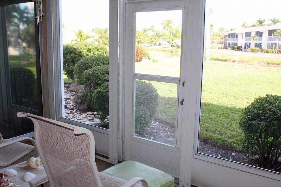 Doorway to outside featuring a water view