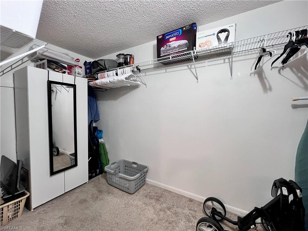 Large Walk in closet with lots of storage space in the primary bedroom