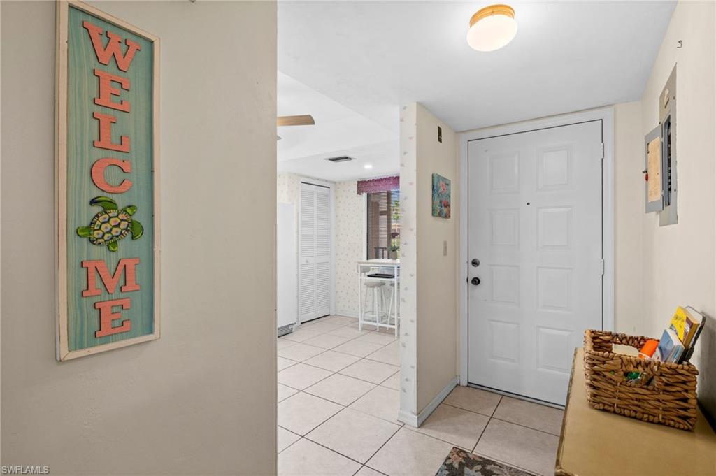 Tiled entry foyer opening into the great room and the eat in kitchen.