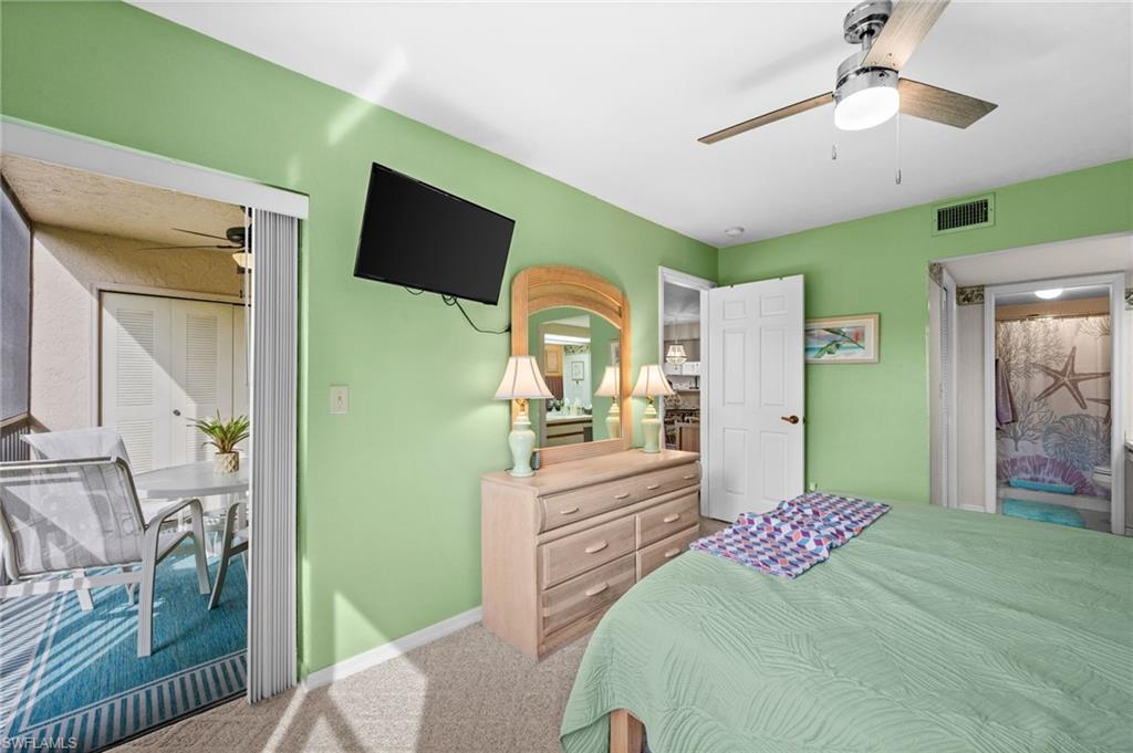Bedroom featuring carpet flooring and light green walls