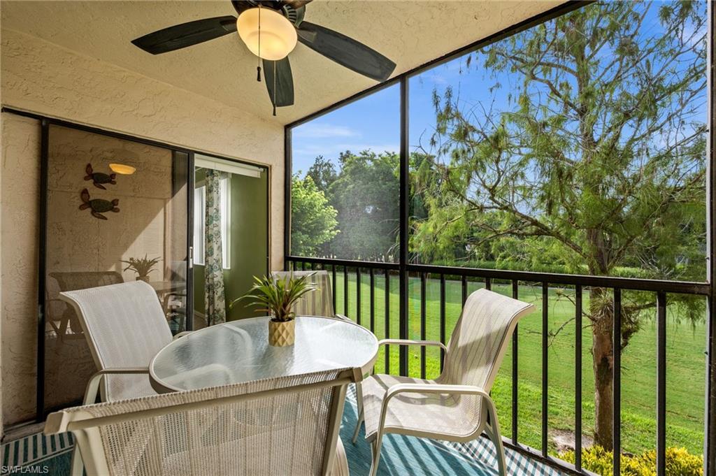 Screened lanai framing a green view over the golf course, ready for morning coffee or an evening drink.