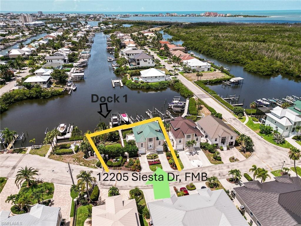 Southern exposure 1.5-lot parcel in the secure, gated enclave of Old Pelican Bay in Fort Myers Beach, the Boater & Fisherman's Paradise.  With it's  bonus rooms, the home offers over 2300 sq ft of living space under air.