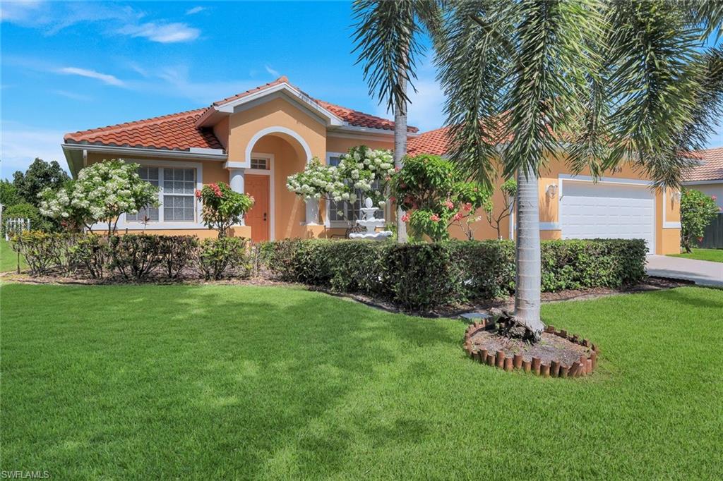Mediterranean-style exterior featuring a terra cotta NEW tile roof (2024)
