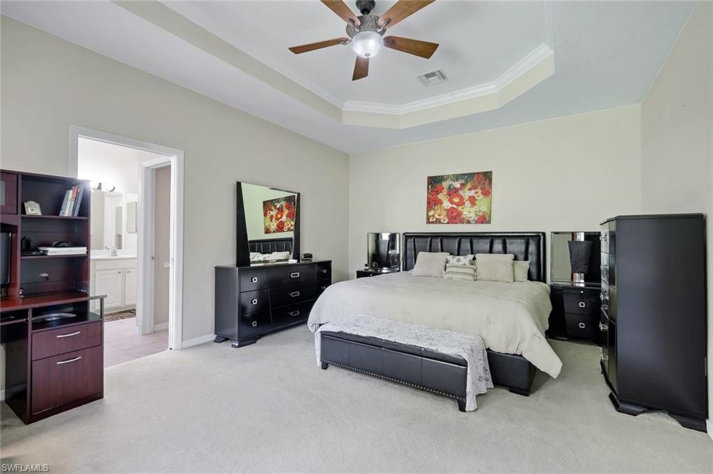 Spacious bedroom featuring light-toned walls and carpet flooring